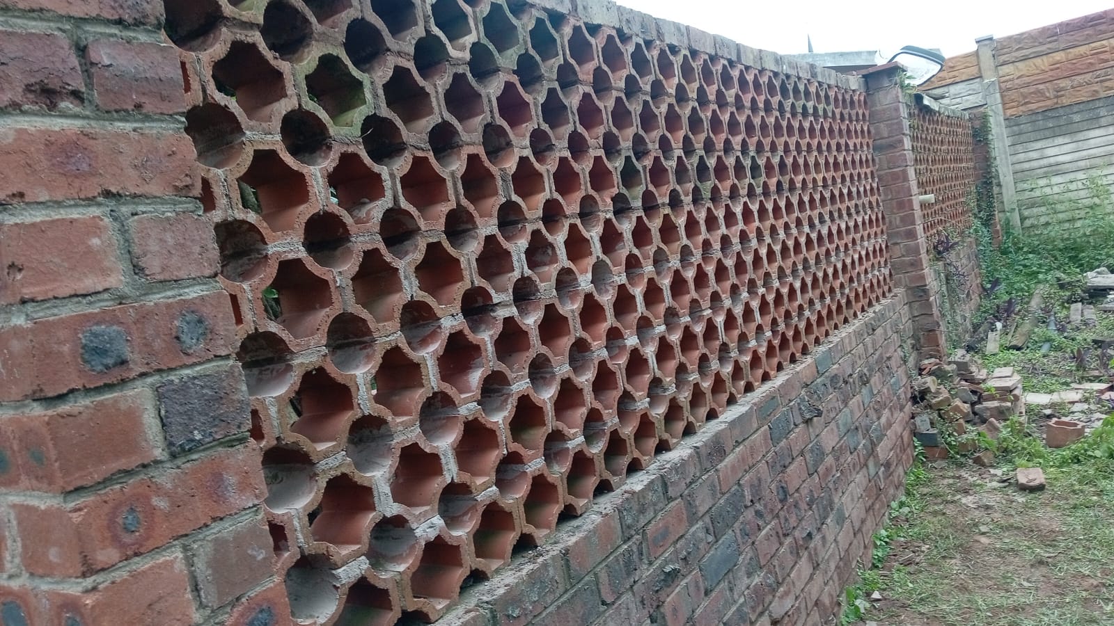 Rebuilt boundary wall and fencing by Africa Works